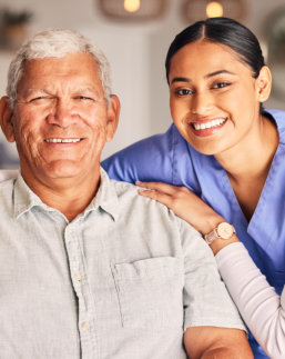 nurse and elderly man smiling