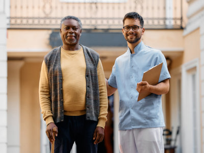 man holding a clipboard with elderly