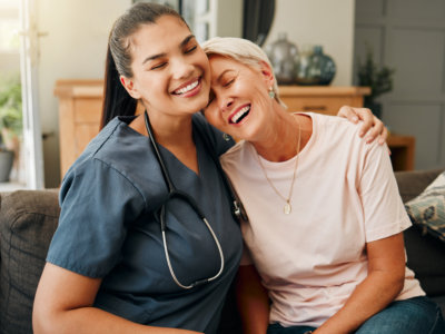 nurse comforting elderly woman