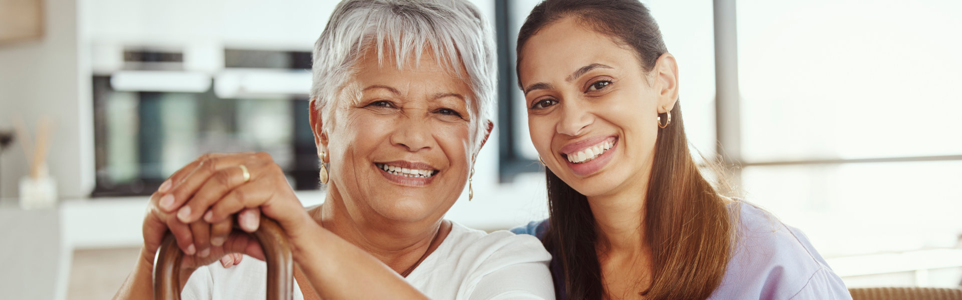 nurse and elderly woman smiling