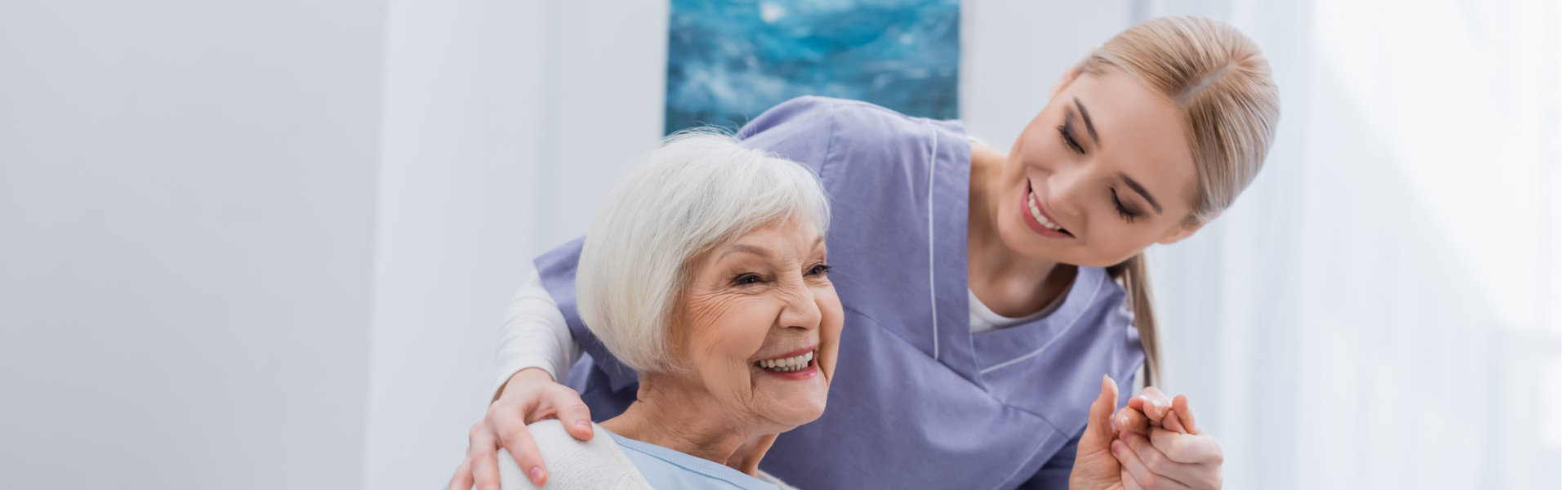 nurse assisting elderly woman