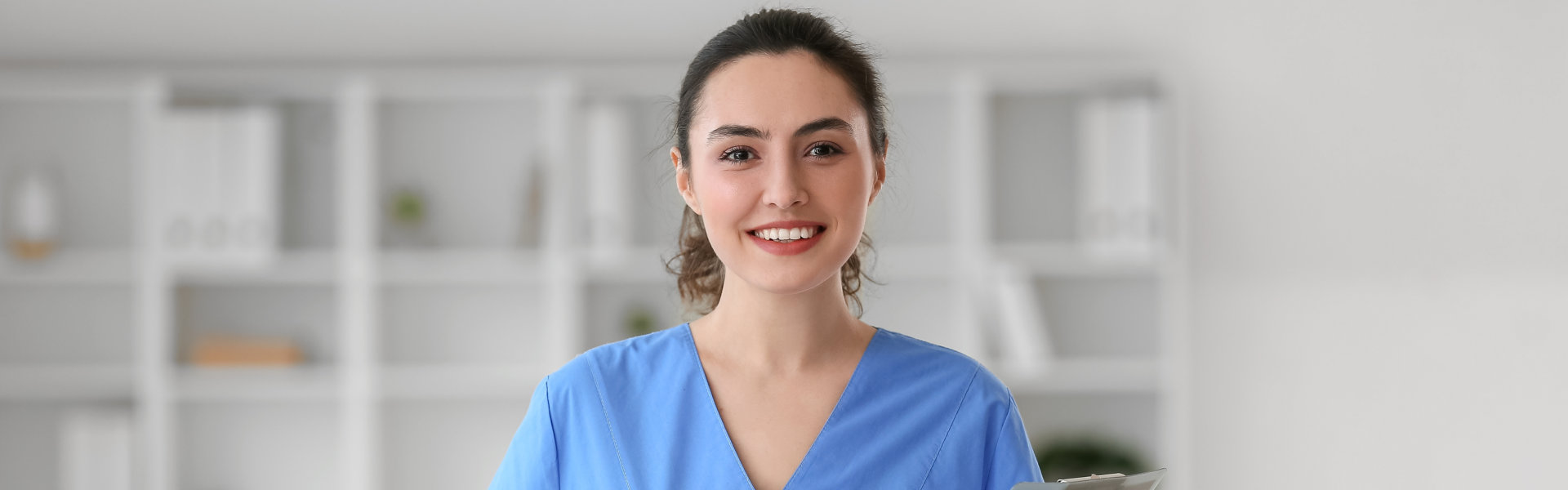 nurse standing and smiling