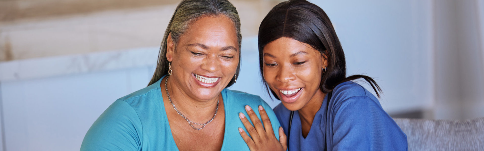 elderly and nurse smiling