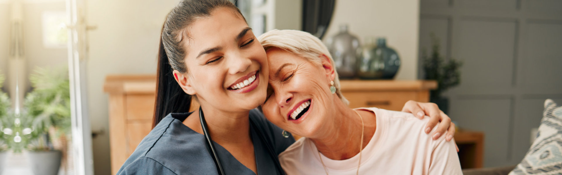 nurse comforting elderly woman